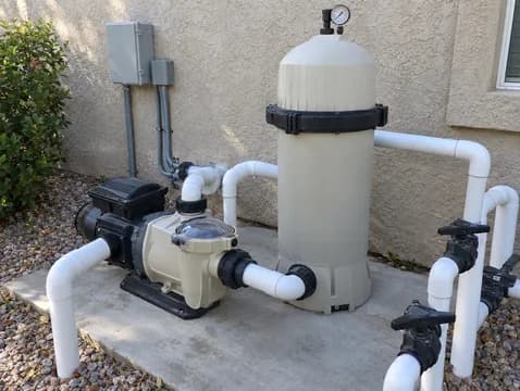 Pump and cartridge filter on the equipment pad